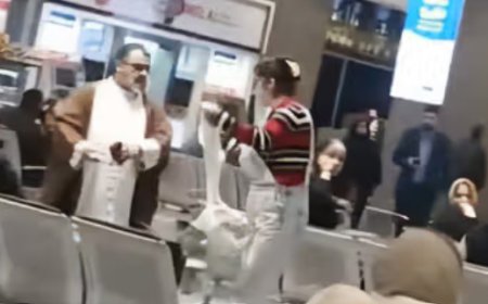Iranian Woman Removes Cleric's Turban in Bold Act of Defiance at Tehran Airport